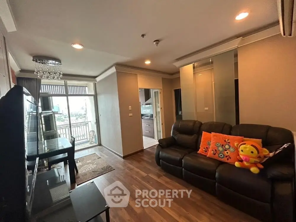 Spacious living room with balcony and modern decor