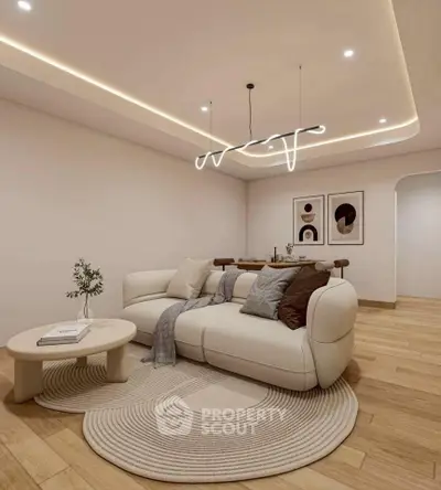 Modern living room with stylish lighting and cozy seating area, perfect for relaxation and entertaining.