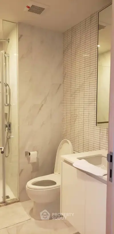 Modern bathroom with sleek design and glass shower enclosure