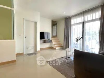 Modern living room with sleek design and natural light