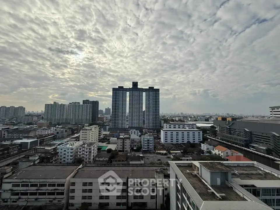 Stunning cityscape view showcasing modern high-rise buildings under a dramatic cloudy sky.