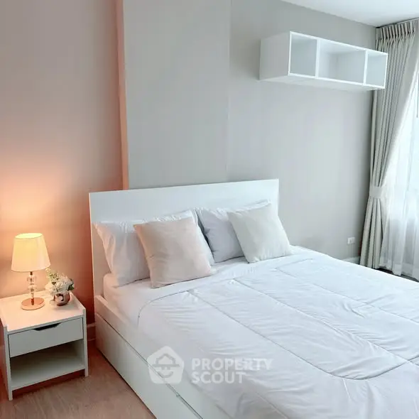 Bright and cozy bedroom with modern white furniture and natural light