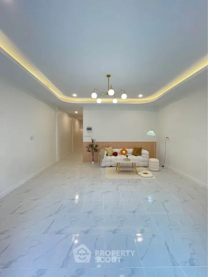 Spacious modern living room with elegant lighting and minimalist decor