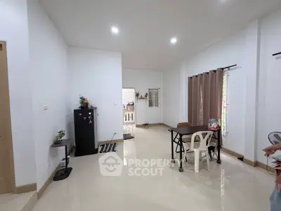 Spacious living room with modern decor and natural light