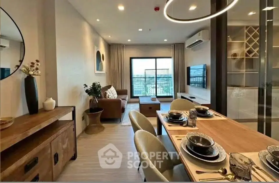 Modern living room with stylish dining area and large window view