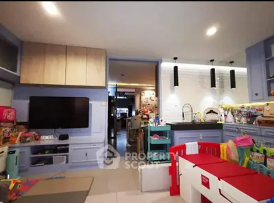 Charming family-friendly living space with modern kitchen and playful decor