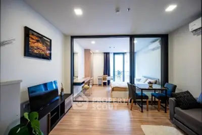 Modern open-plan living room with stylish decor and natural light