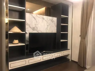 Modern living room with stylish TV unit and marble accent wall
