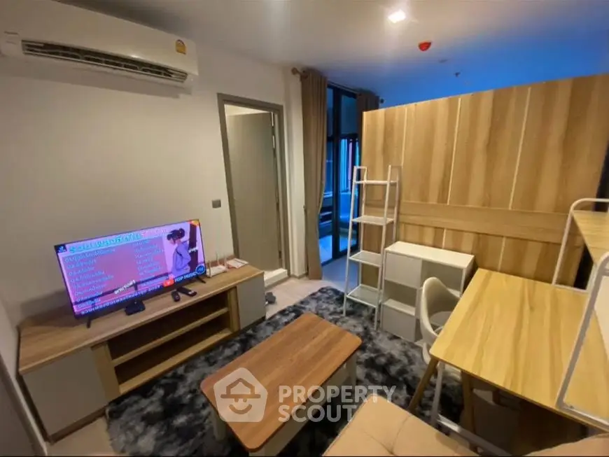 Modern living room with stylish furniture and air conditioning in a cozy apartment.