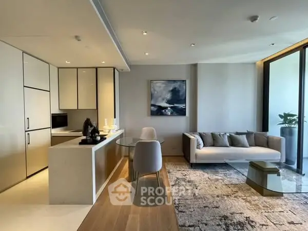 Modern open-plan living room with sleek kitchen and stylish decor