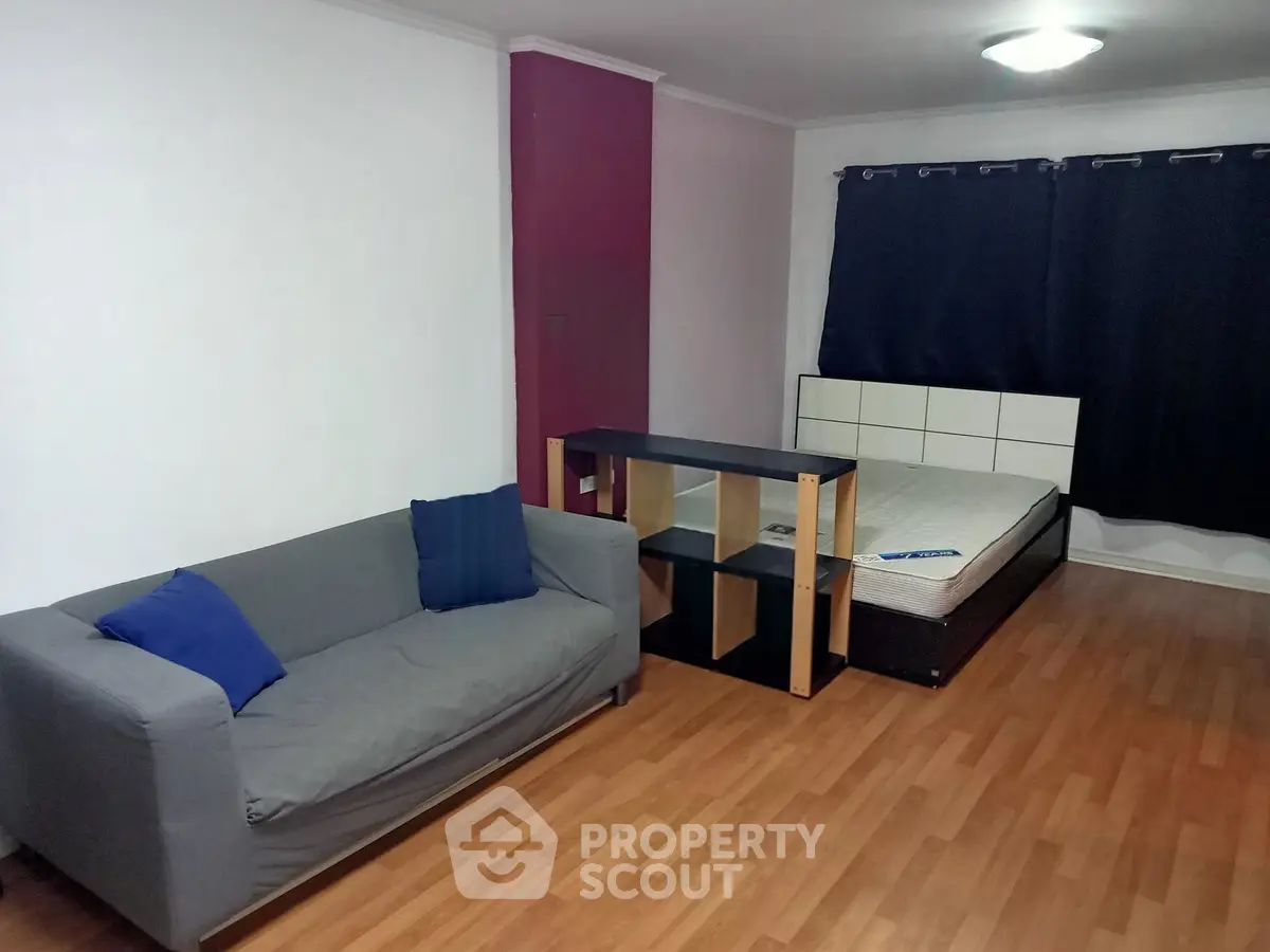 Spacious studio apartment with modern furnishings and hardwood floors