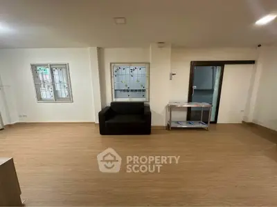 Spacious modern living room with sleek flooring and minimalist decor