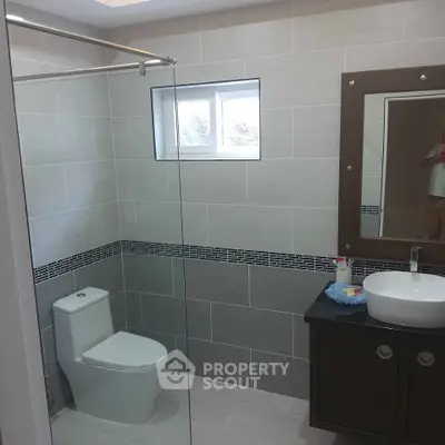 Modern bathroom with sleek design and glass shower enclosure