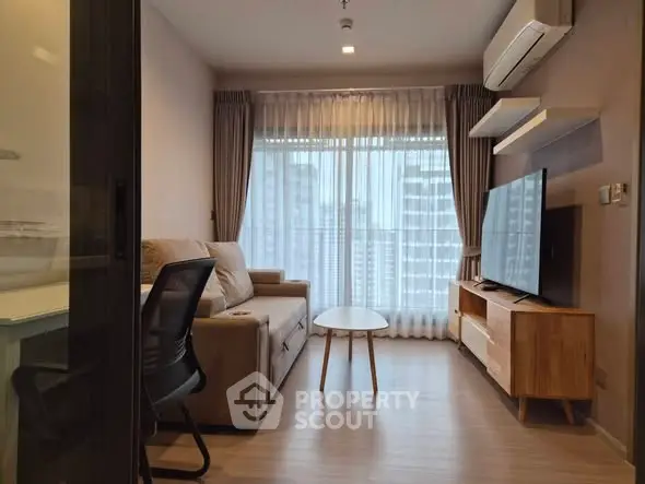 Modern living room with city view, featuring cozy sofa, sleek TV unit, and large window for natural light.