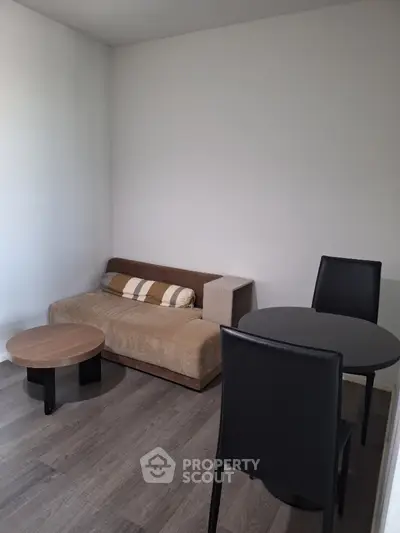Cozy minimalist living room with modern furniture and wooden flooring