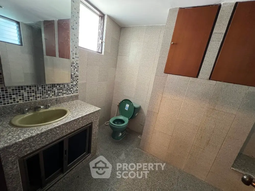 Spacious bathroom with modern fixtures and ample natural light
