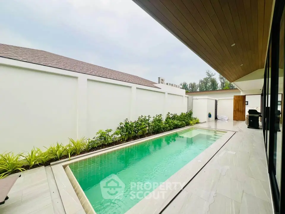 Luxurious private villa with sleek pool and modern design, perfect for relaxation and entertainment.