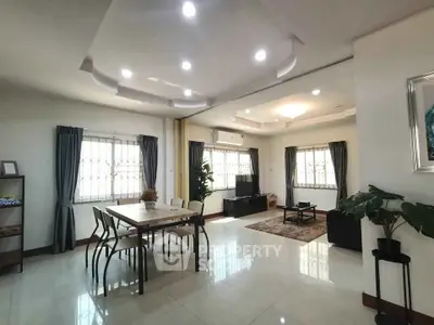 Spacious modern living room with elegant dining area and stylish decor