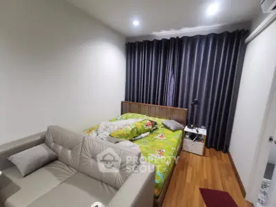 Cozy bedroom with modern decor and comfortable bed, perfect for relaxation.