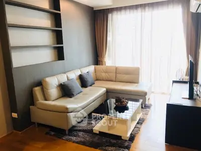 Modern living room with stylish sectional sofa and natural light