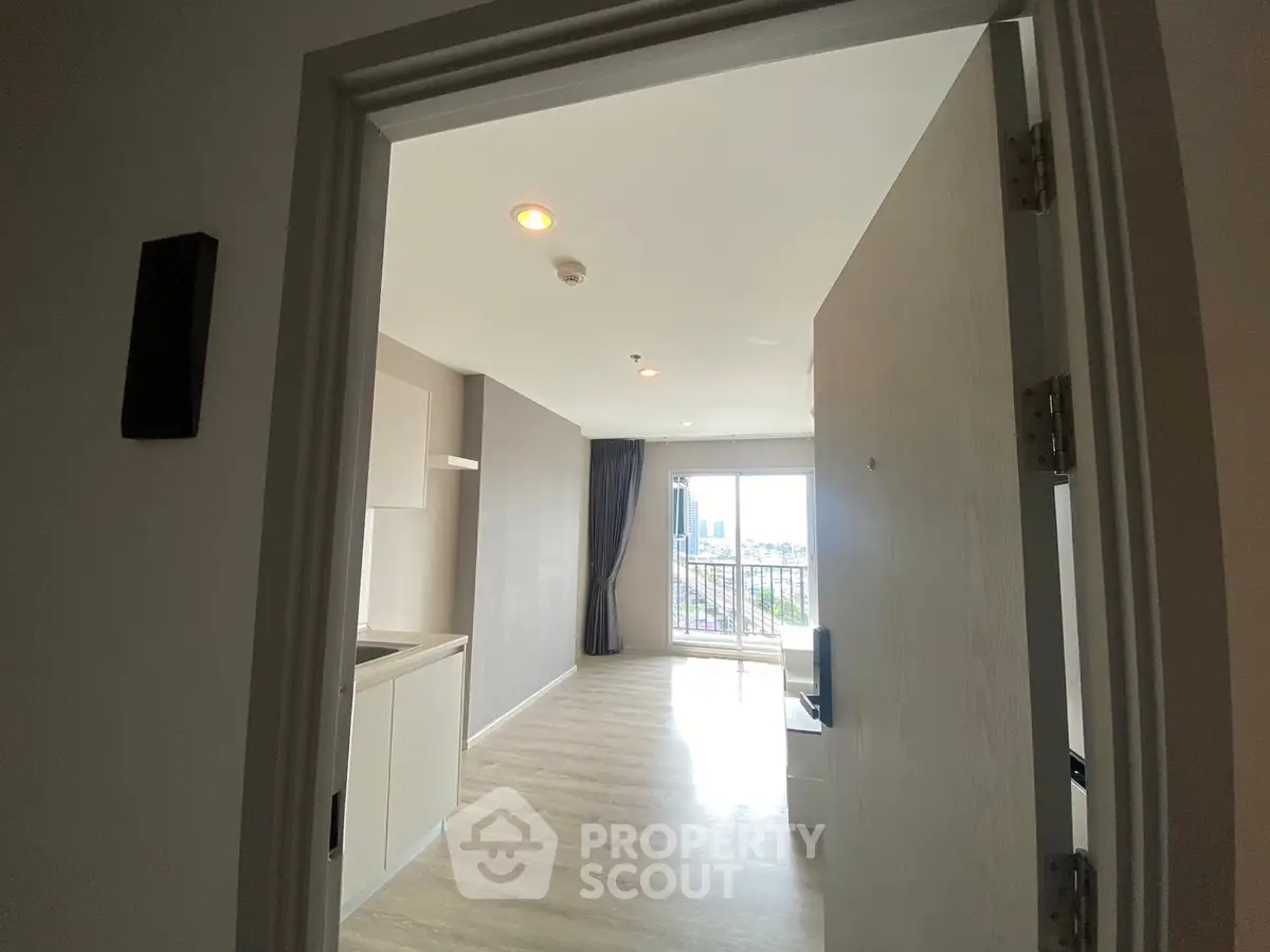 Modern apartment interior with open layout and balcony view