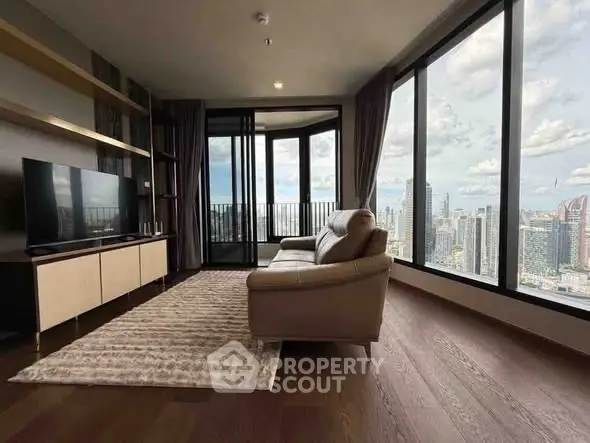 Luxurious living room with stunning city view and modern furnishings.