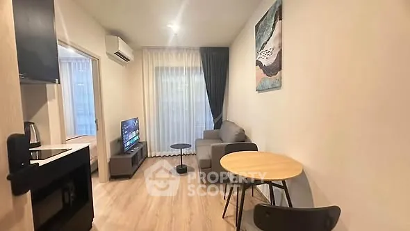Modern living room with cozy furniture and stylish decor in a contemporary apartment.
