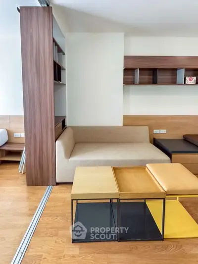 Modern living room with stylish furniture and wooden flooring