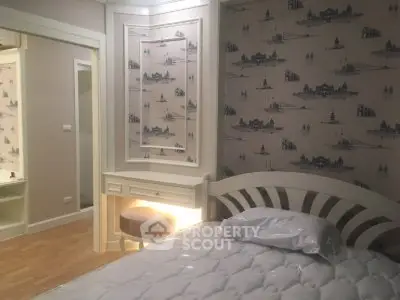 Charming bedroom with elegant wallpaper and cozy lighting, perfect for relaxation.