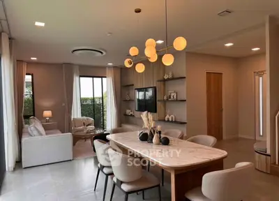 Elegant modern living room with dining area and stylish lighting