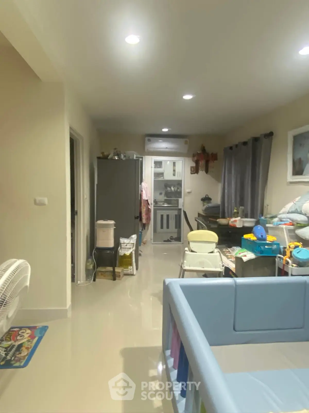 Spacious family living room with modern decor and ample natural light