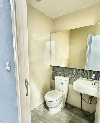 Modern bathroom with sleek fixtures and neutral tones, perfect for a contemporary home.
