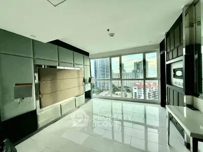 Spacious modern living room with panoramic city view and sleek design.