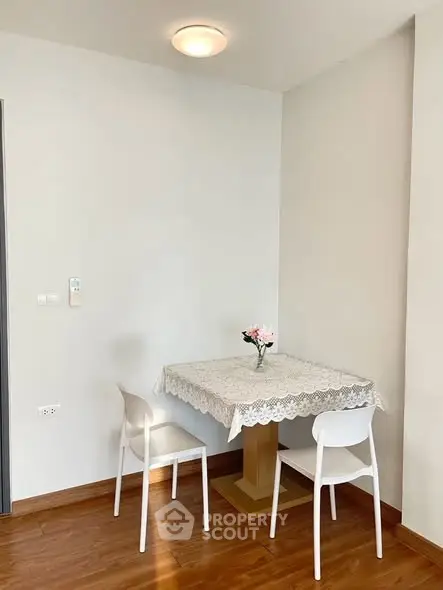 Cozy dining nook with elegant table and chairs in a modern apartment.