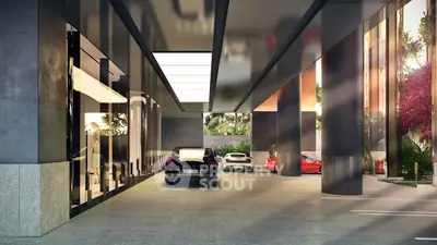 Luxurious building entrance with sleek modern design and high-end cars parked.