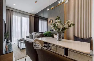 Modern living room with elegant decor and natural light, featuring a stylish dining area and cozy seating.