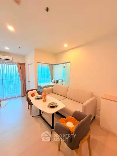 Modern living room with cozy sofa and dining area in bright apartment