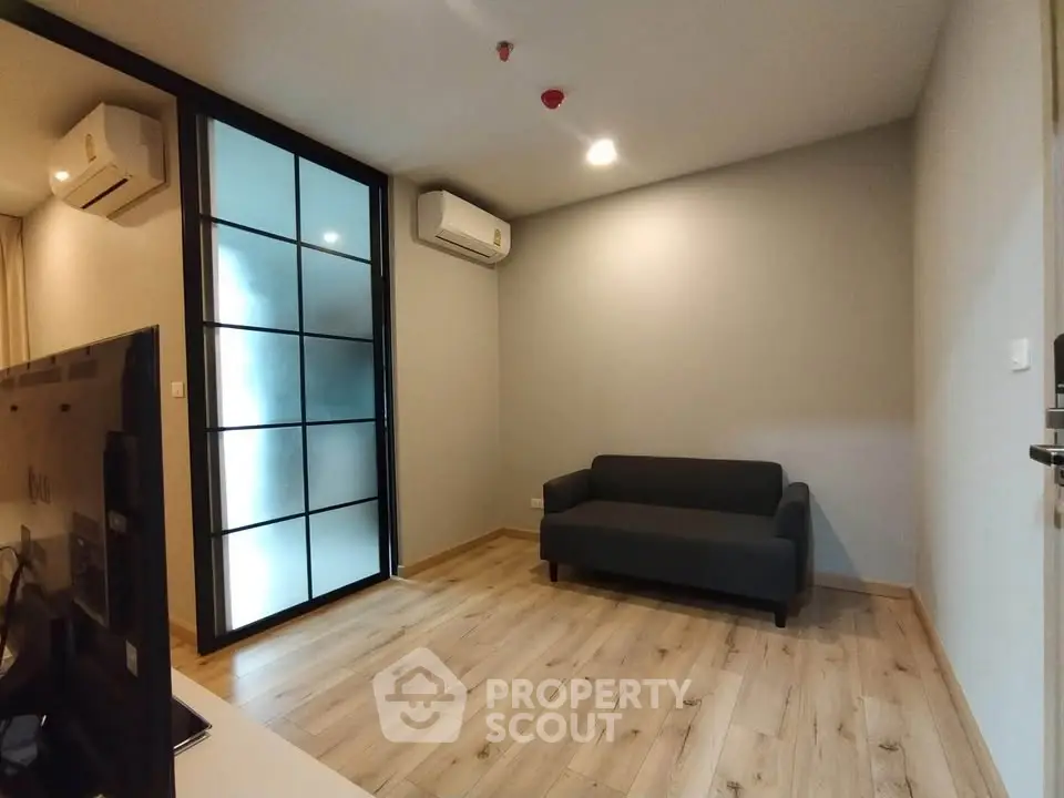 Modern living room with sleek design and wooden flooring