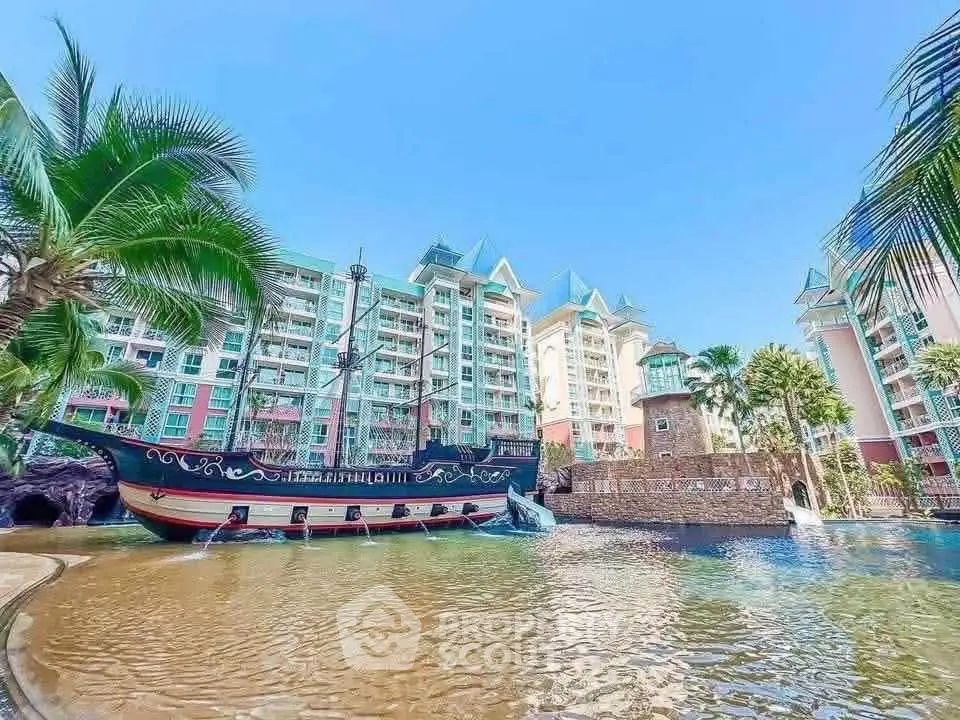 Luxurious resort-style condominium with pirate ship pool and lush landscaping.