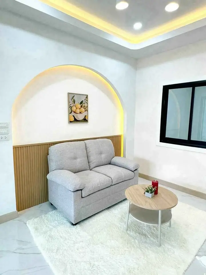 Modern living room with cozy sofa and stylish decor