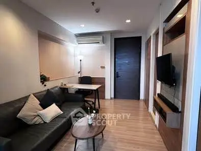 Modern living room with sleek furniture and stylish decor in a cozy apartment.