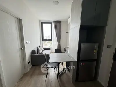 Modern compact living room with dining area and large window view