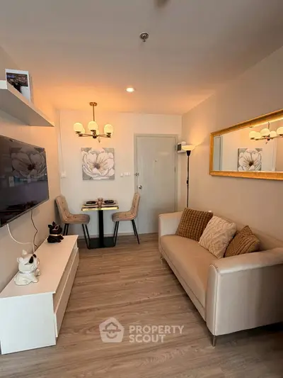 Cozy living room with modern decor and elegant lighting, perfect for relaxation and entertainment.