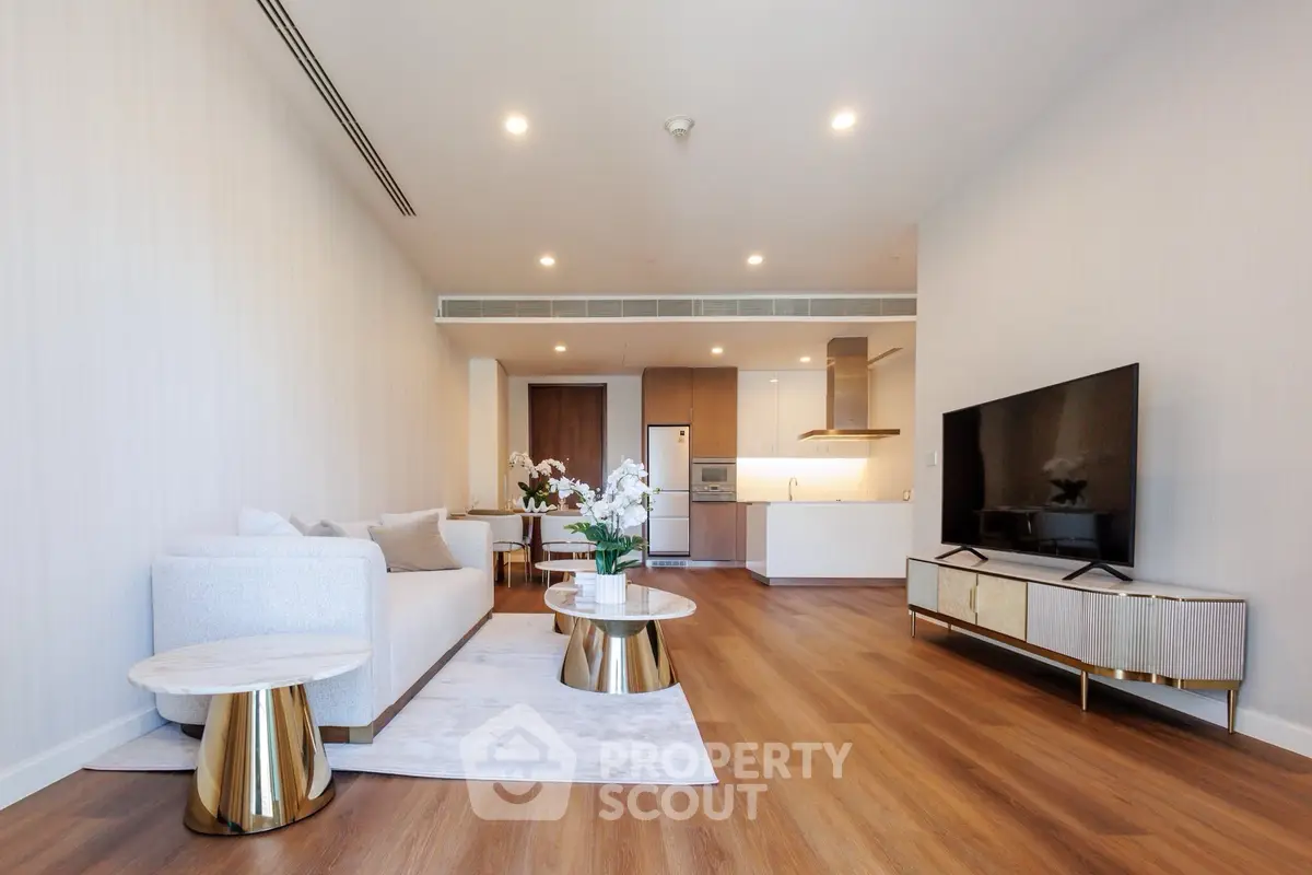 Spacious modern living room with elegant decor and open kitchen layout