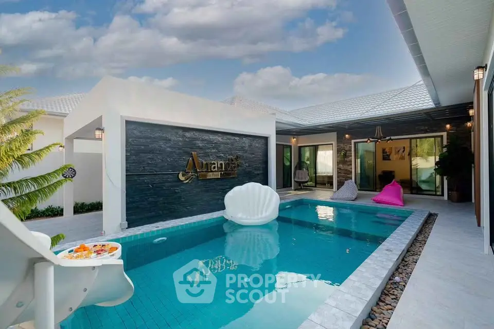 Luxurious modern villa with private pool and stylish outdoor seating area, perfect for relaxation and entertainment.