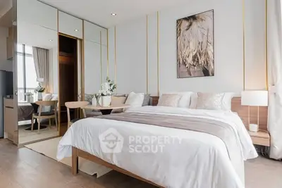 Luxurious modern bedroom with elegant decor and mirrored wardrobe