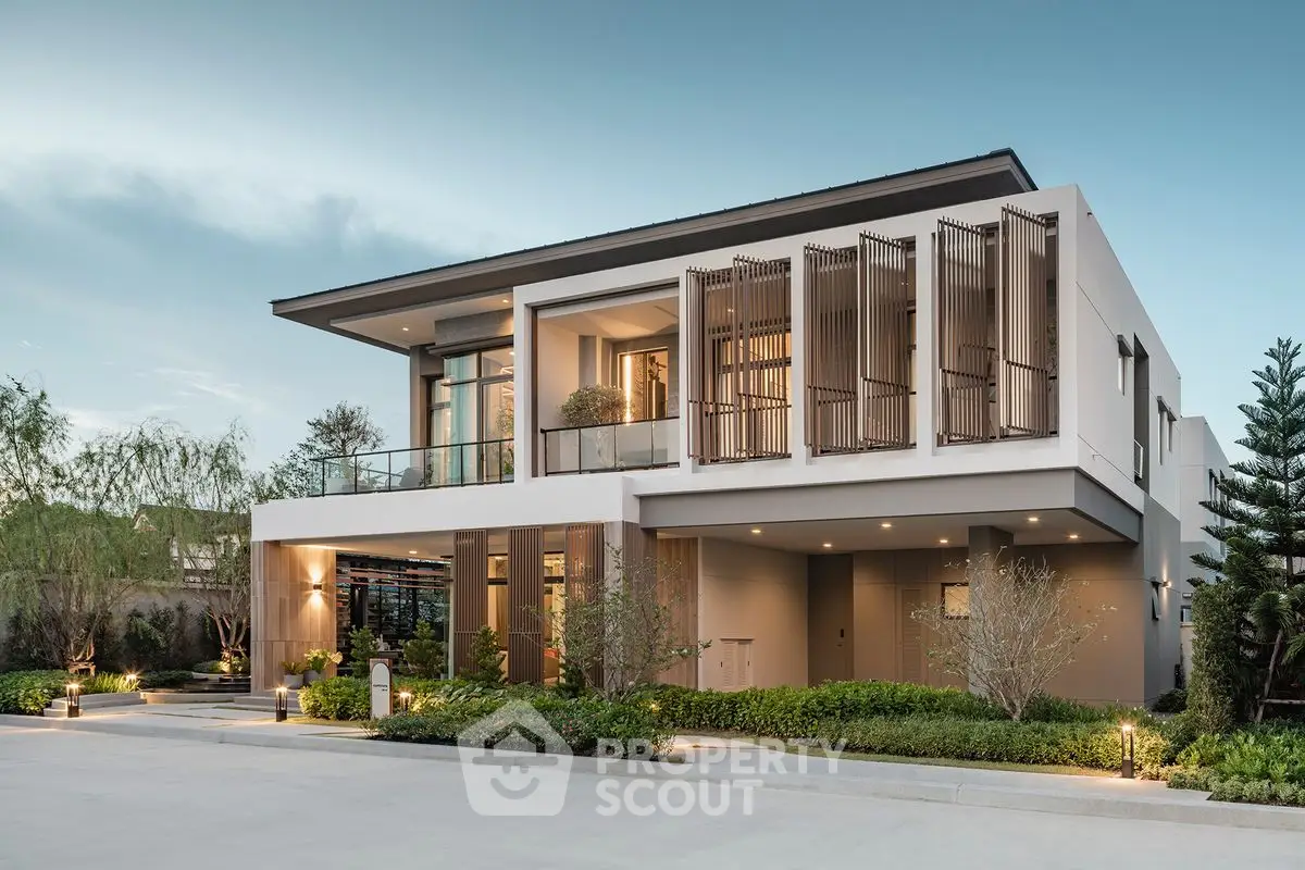 Modern luxury home exterior with sleek design and lush landscaping