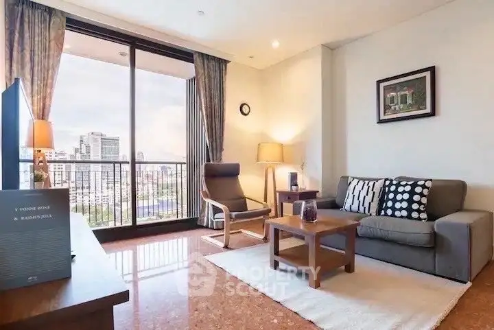 Spacious living room with city view, modern furniture, and large windows in a high-rise apartment.