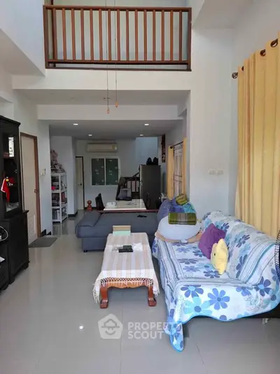 Spacious living room with cozy seating and modern decor in a stylish home.