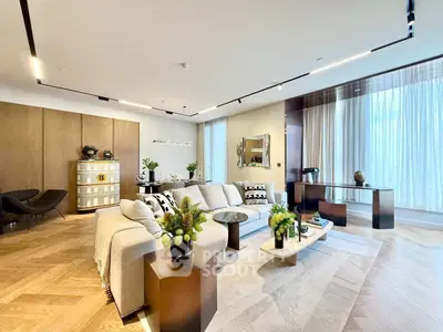 Luxurious modern living room with elegant decor and abundant natural light
